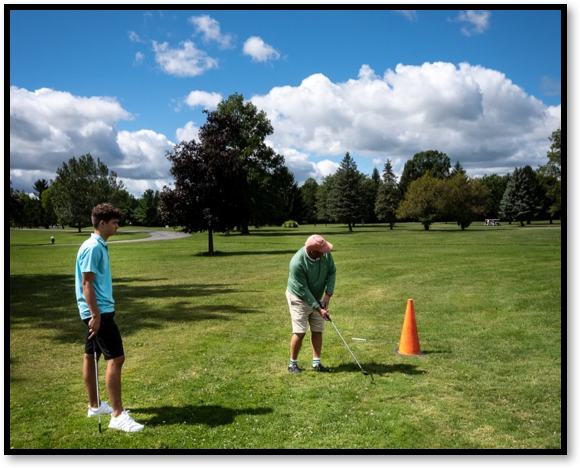 With his son Cooper watching, Fred's pitch goes in the hole!! Winner!